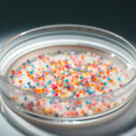 Macro shot of microplastics composition inside a lab petri dish. Concept of plastic pollution with nanoplastics.
