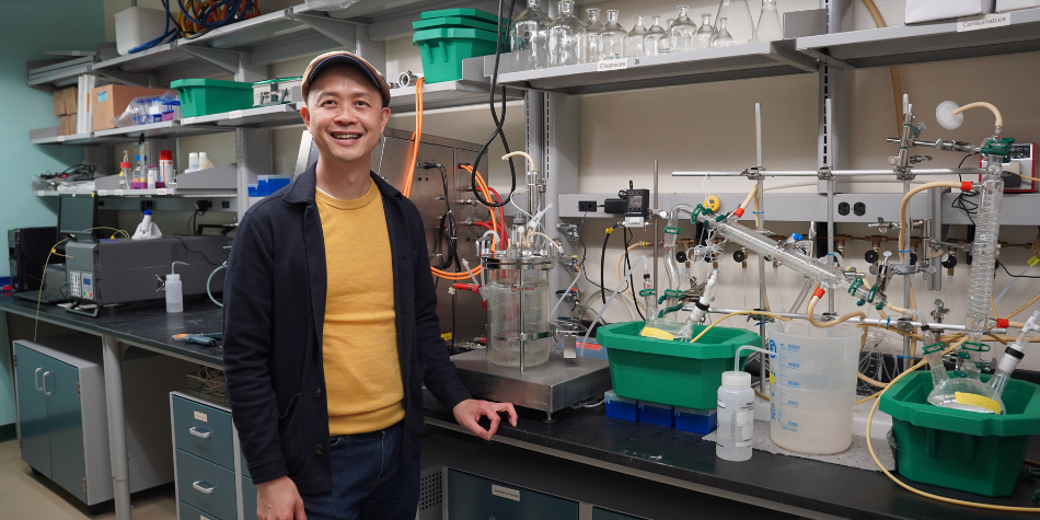 Cong Trinh poses for a photo in his lab