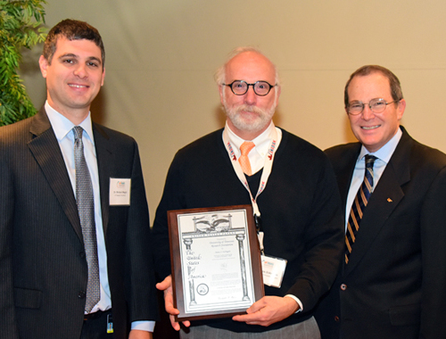 Dr. DiAngelo receiving a patent plaque at the UTRF Innovation Awards ceremony in 2017.